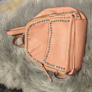 Coral color Urban Expressions backpack with embellishments